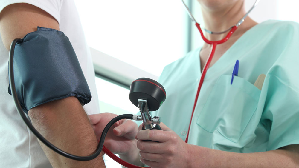 Nurse taking blood pressure